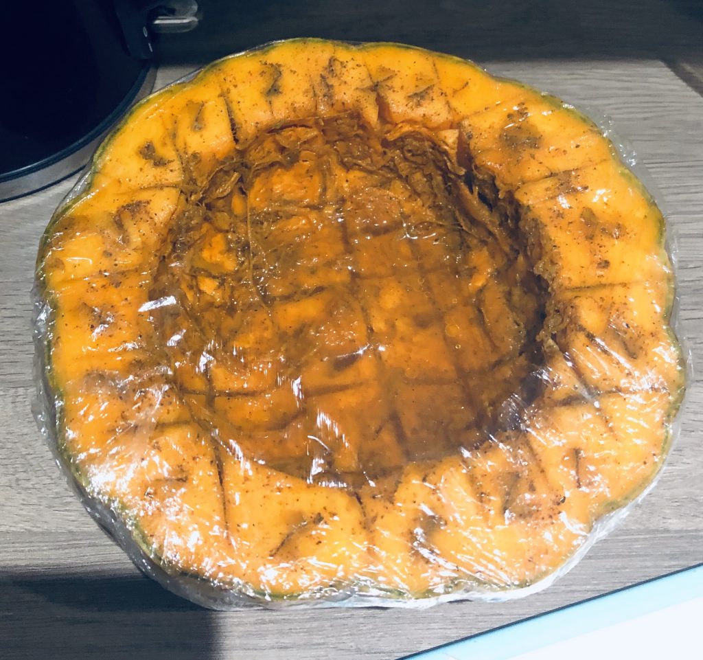 Top down image of a roasted pumpkin for the soup.