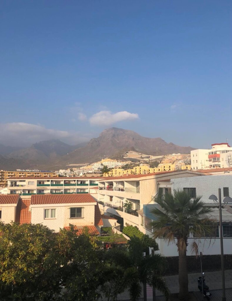View of Tenerife with mountains in distance and blue skies 