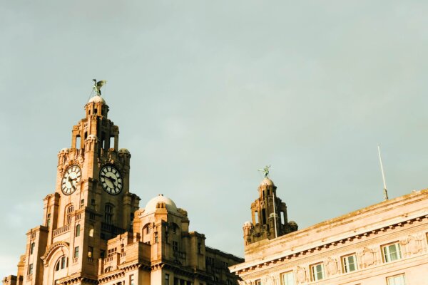 brown concrete building (liver building) under grey sky during daytime, demonstrating colonialism